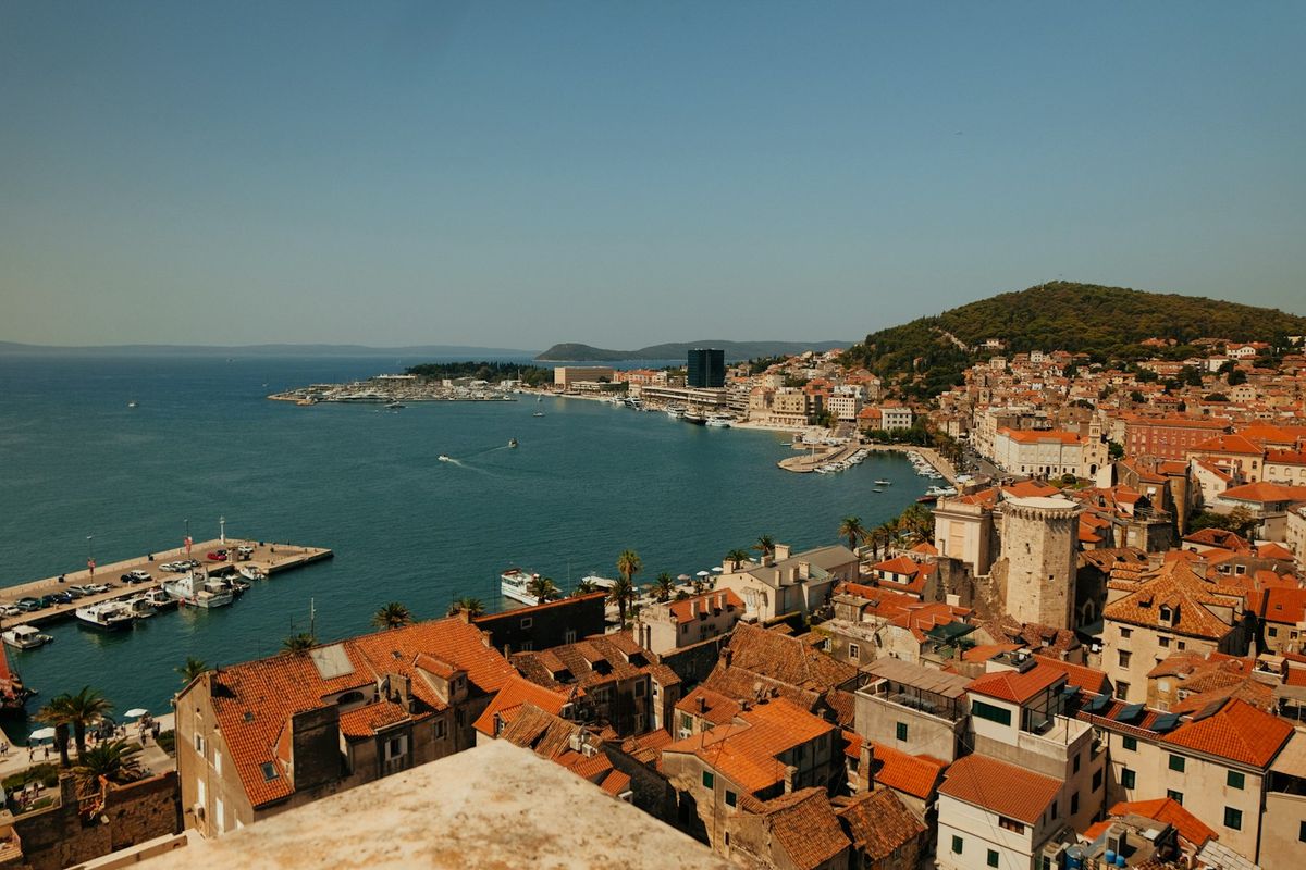 Split's old town rooftops and harbour, with Marjan hill behind
